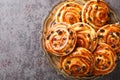 Delicious pain aux raisins spiral buns with raisins and custard close-up in a plate. horizontal top view Royalty Free Stock Photo