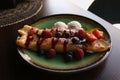 Delicious pancakes with fresh berries and ice cream on wooden table, closeup Royalty Free Stock Photo