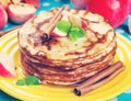 Delicious pancakes, honey apples and cinnamon. Vintage retro hip