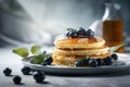 Delicious pancakes with honey, blueberries,