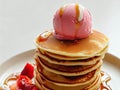 Delicious pancakes on plate with maple syrup and ice cream topping Royalty Free Stock Photo