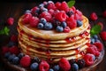 Delicious pancakes topped with fresh berries and drizzled with sweet maple syrup at an upscale cafe Royalty Free Stock Photo