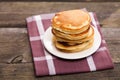 Delicious pancakes on a wooden table