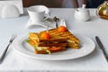 Delicious Panini sandwich with cherry tomatoes in the restaurant Royalty Free Stock Photo