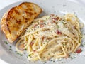 Delicious pasta dish with garlic bread