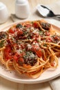 Delicious pasta with meatballs and tomato sauce served on wooden table, closeup Royalty Free Stock Photo