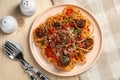 Delicious pasta with meatballs and tomato sauce served on wooden table, flat lay Royalty Free Stock Photo