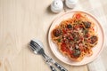 Delicious pasta with meatballs and tomato sauce served on wooden table, flat lay. Space for text Royalty Free Stock Photo