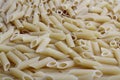 Delicious pasta, penne noodles background. Top view scene, healthy eating or healthy lifestyle. Royalty Free Stock Photo