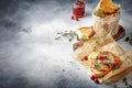 Delicious pate of chicken liver and meat on grilled toasts with cranberries and thyme, gray kitchen table background, space for Royalty Free Stock Photo