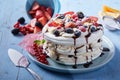 Delicious Pavlova cake with cream and meringue