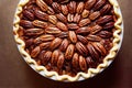 Delicious pecan pie in shortbread dough on wooden table