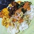 Delicious pecel rice on the plate