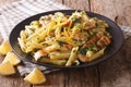 Delicious penne pasta with herbs, chicken breast and lemon peel Royalty Free Stock Photo