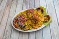 Delicious Peruvian dish of seafood rice. Cangrejo, guisantes, perejil, Prawns, scallops, mussels, clams, squid, red onion, and Royalty Free Stock Photo