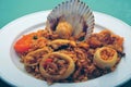 Delicious Peruvian dish of seafood rice. Cangrejo, guisantes, perejil, Prawns, scallops, mussels, clams, squid, red onion, and Royalty Free Stock Photo
