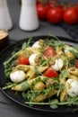 Delicious pesto pasta salad on gray table, closeup Royalty Free Stock Photo
