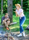 Delicious picnic food. Girl in straw hat trying roasted food nature background. Foods to cook on stick. Tips every