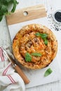 Delicious pie Spanakopita with soft feta cheese and spinach on old white wooden table backgrounds. Traditional Greek Spiral filo Royalty Free Stock Photo