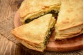 Delicious pie with spinach and feta cheese - spanakopita, traditional greek cuisine. Royalty Free Stock Photo