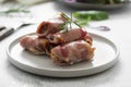 Delicious pigs in blankets, meat wrapped in bacon, homemade cooked meat bites. Bright food photo