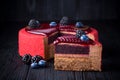 Delicious pink cake with berries on wooden table Royalty Free Stock Photo
