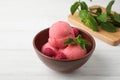 Delicious pink ice cream served with raspberries and mint in bowl on white wooden t Royalty Free Stock Photo