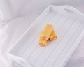 Delicious pink and yellow Battenberg cake, the traditional sweet afternoon tea snack. Royalty Free Stock Photo