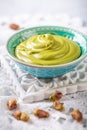 Delicious pistachio cream in a bowl with nuts Royalty Free Stock Photo