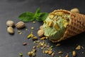 Delicious pistachio ice cream on dark table Royalty Free Stock Photo