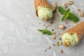 Delicious pistachio ice cream on grey marble table, flat lay Royalty Free Stock Photo