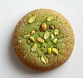 Delicious pistachiotopped cookie on white surface, a perfect finger food Royalty Free Stock Photo