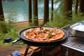 delicious pizza baking on a portable camping oven