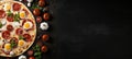 Delicious pizza on black stone background with top view ingredients and empty space for text