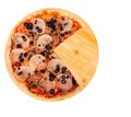 Delicious pizza with ham, mozzarella, mushrooms and olives, without a quarter on a round wooden platter, isolated on white Royalty Free Stock Photo