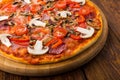 Delicious pizza with mushrooms, peppers and pepperoni Royalty Free Stock Photo