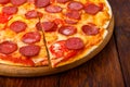 Delicious pizza with pepperoni and tomatoes Royalty Free Stock Photo