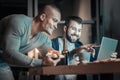 Optimistic two colleagues chewing pizza Royalty Free Stock Photo