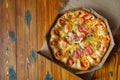 Delicious Pizza Served in the Delivery Box on the Wood Table, Italian Pizza in a Cardboard Box Royalty Free Stock Photo