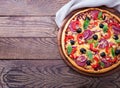 Delicious pizza served on wooden table top view Royalty Free Stock Photo