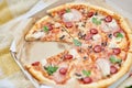 Delicious Pizza With Tomato, Cheese, and Greens in a Cardboard Box Outdoors