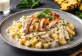 A delicious plate chicken alfredo,but instead chicken use diced pineapples