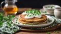 Delicious plate of golden brown potato pancakes with creamy sour cream