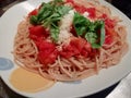 Plate of Italian spaghetti with ragu and fresh basil