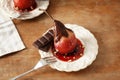 Delicious poached pear in red wine with chocolate sauce on plate Royalty Free Stock Photo