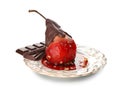 Delicious poached pear in red wine with chocolate sauce on plate,  on white Royalty Free Stock Photo