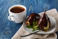 Delicious poached pears with chocolate syrup ready to serve Royalty Free Stock Photo