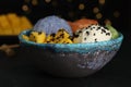 Delicious poke bowl on table against blurred lights, closeup