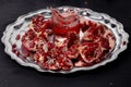 Image pomegranate and juice on the silver tray