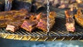 Crusty pork ribs roasting on grill outside Royalty Free Stock Photo